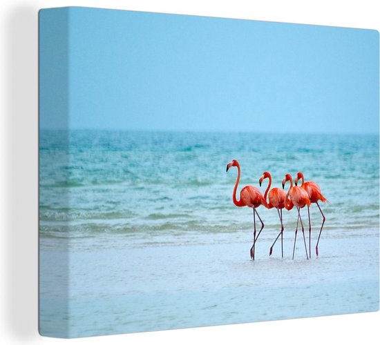 Canvas schilderij 160x120 cm - Wanddecoratie Vier flamingo's staan op het strand - Muurdecoratie woonkamer - Slaapkamer decoratie - Kamer accessoires - Schilderijen