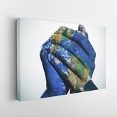 Canvas schilderij - A world map in man hands forming a globe (Earth map furnished by NASA) -     170752253 - 115*75 Horizontal