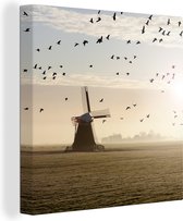 Tableau sur toile Oies au-dessus d'un moulin à vent aux Nederland - 50x50 cm - Décoration murale