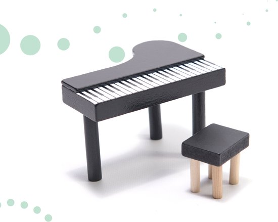 Zwarte speelgoedpiano met witte toetsen en een zwart krukje.