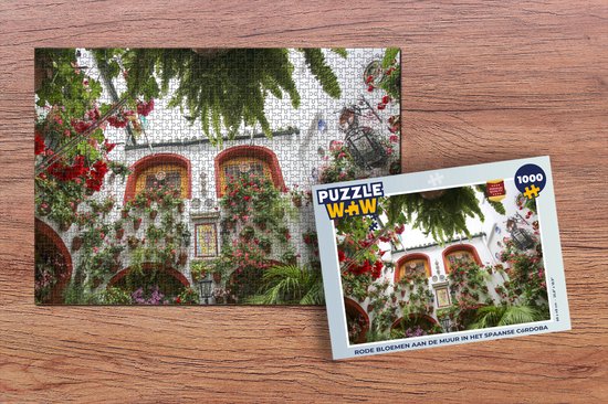 Puzzel Rode bloemen aan de muur in het Spaanse Córdoba - Legpuzzel