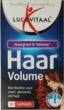 Doos "Haar Volume" supplement met afbeelding van vrouw met rood haar.