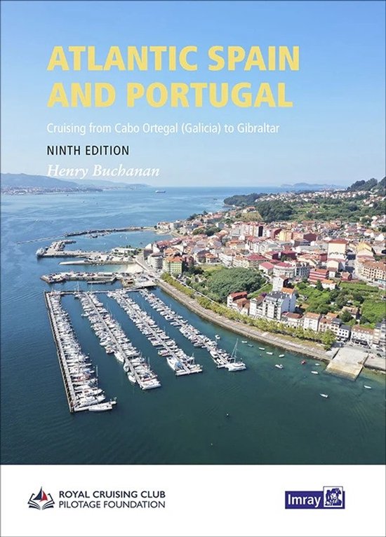 Boek 'Atlantic Spain and Portugal', negende editie. Een luchtfoto van een haven met veel boten, met een kuststad op de achtergrond.