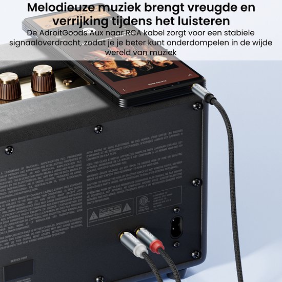 Smartphone aangesloten op een Marshall luidspreker met een zwarte kabel.