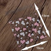 Jumada's - Uitdeelzakjes - Koekzakjes - Snoepzakjes - 100 stuks - Transparante Uitdeelzakjes met plakstrip - Hartjes - 13x10cm - Valentijns zakjes - Wit & Roze