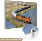MuchoWow® Glasschilderij 120x80 cm - Schilderij acrylglas - Een oranje gekleurde trein - Foto op glas - Schilderijen