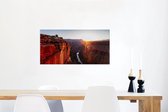 Canvas Schilderij Zonnestralen boven een berglandschap en de Colorado rivier in de Verenigde Staten - 80x40 cm - Wanddecoratie