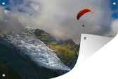 Tuinposter - Tuindoek - Tuinposters buiten - Alpen - Paragliding - Sneeuw - 120x80 cm - Tuin