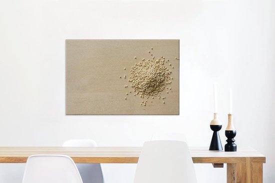 Stapel quinoa op een houten snijplank Canvas 140x90 cm - Foto print op Canvas schilderij (Wanddecoratie woonkamer / slaapkamer)