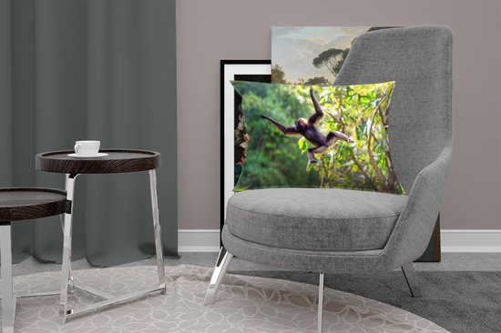 Sierkussen Jungle Residents pour intérieur - Singe sautant dans la jungle - 60x40 cm - coussin intérieur rectangulaire en coton