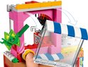 LEGO-klauwspel met een speelse groene geldbiljet-figuur met gezicht, die geld pakt.