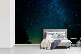 Behang - Fotobehang Een vortex van de Melkweg aan de hemel - Breedte 420 cm x hoogte 280 cm
