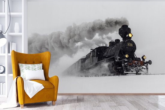 Behang - Fotobehang Stoomlocomotief in de sneeuw - liggend - Breedte 420 cm x hoogte 280 cm