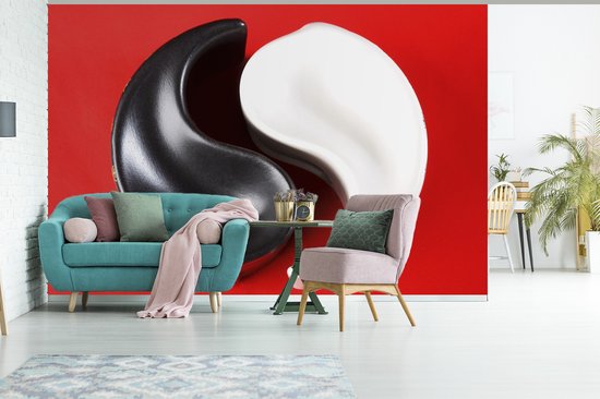 Cendrier Yin et Yang devant un fond d' fotobehang rouge