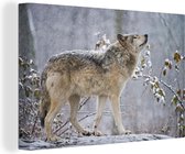 Canvas Schilderij Wolf - Sneeuw - Winter - 90x60 cm - Wanddecoratie