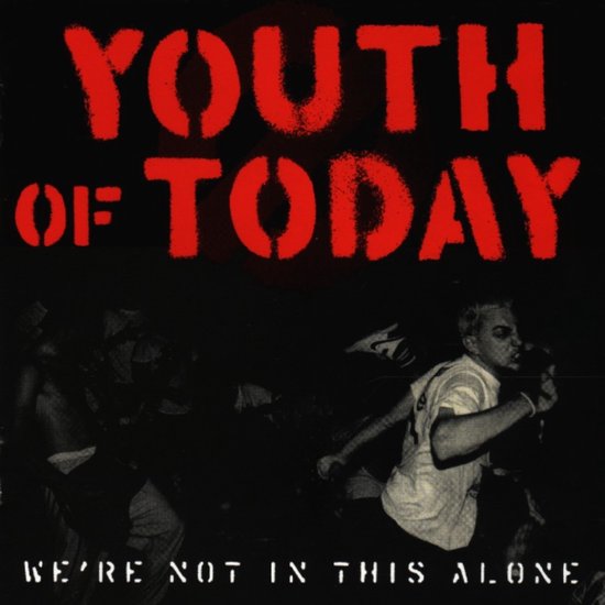 Album cover met de tekst YOUTH OF TODAY en WE'RE NOT IN THIS ALONE. Een man op de voorgrond.