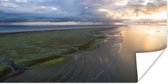 Kleurrijke lucht boven Schiermonnikoog en de Waddenzee Poster 160x80 cm - Foto print op Poster (wanddecoratie woonkamer / slaapkamer) / Zeeën en meren Poster / Zee en Strand