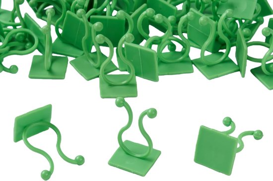 Een verzameling groene plantenclips met vierkante bases en gebogen steeltjes met bolle uiteinden.
