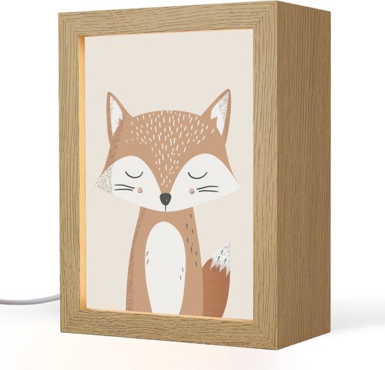 Lampe en bois avec un renard brun mignon, éclairée de l'intérieur.