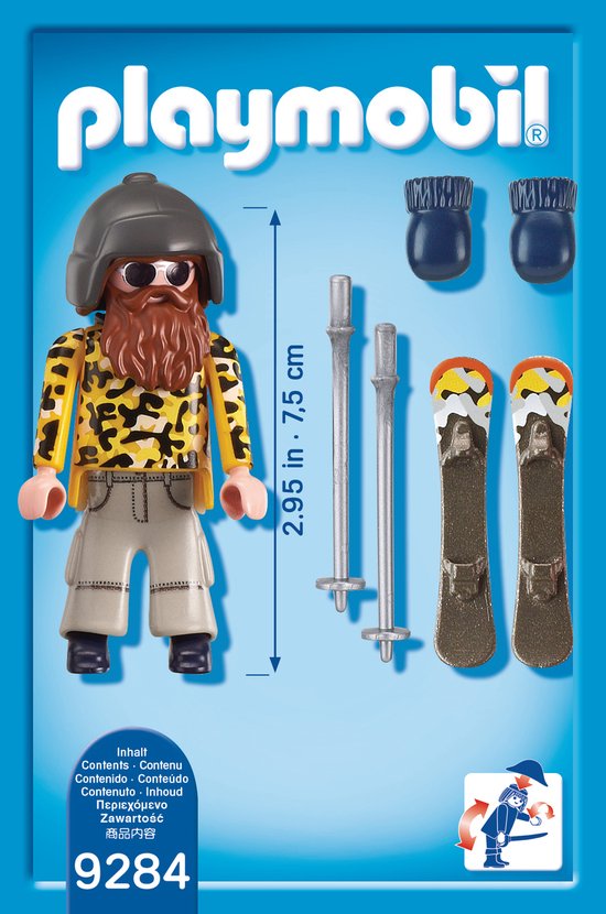 Playmobil skiër met baard, skibril, gele jas met luipaardprint en beige broek, inclusief ski's, stokken en blauwe wanten.