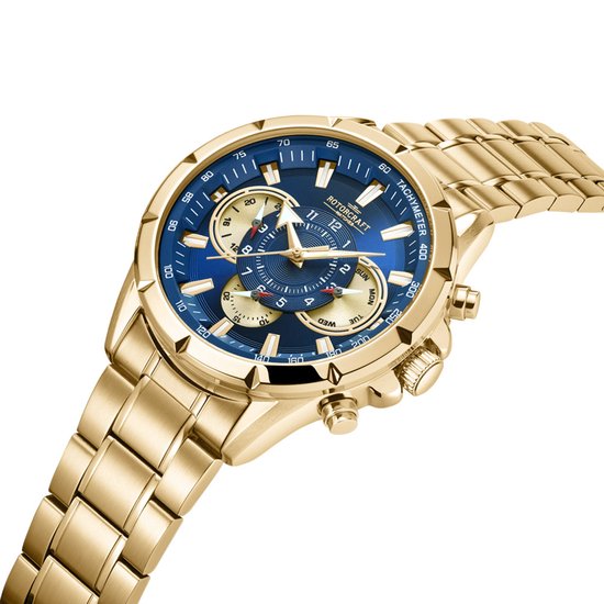 Gouden horloge met blauwe wijzerplaat, gouden band. Chronograaf met tachymeter, dag en datum, schuin van voren gefotografeerd.