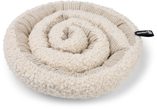 Crème, rond, opgerold speeltje met teddy voering en beige ribbels.