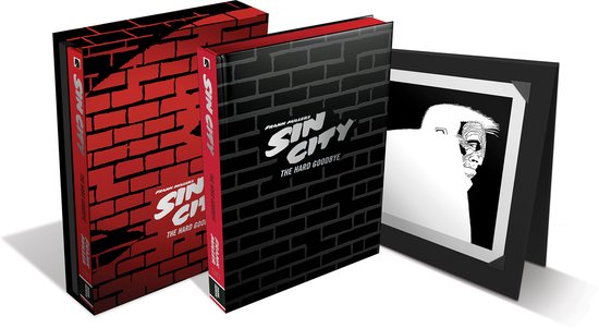 Twee Sin City boeken, één met rode bakstenen print, de ander met zwarte bakstenen. Een ingelijste zwart-wit illustratie met gezicht.