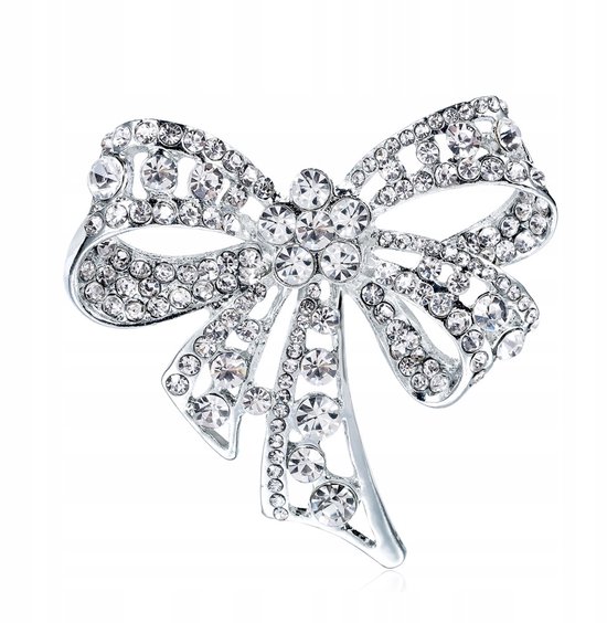 Broche nœud argenté ornée de nombreux strass clairs.
