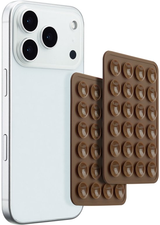 Un iPhone blanc avec deux tapis de ventouses marron sur le dos.