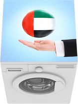 Wasmachine beschermer mat - Vlag van de Verenigde Arabische Emiraten zweeft boven een hand - Breedte 60 cm x hoogte 60 cm