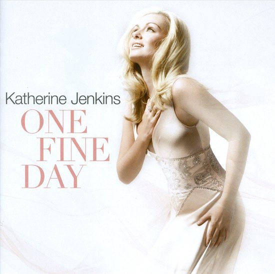 Katherine Jenkins in een lichtroze jurk met geborduurde tailleband, kijkend naar boven. Titel 'ONE FINE DAY'.