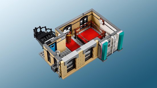 LEGO slaapkamer met rood bed, bureau, balkon en een teal accent muur.