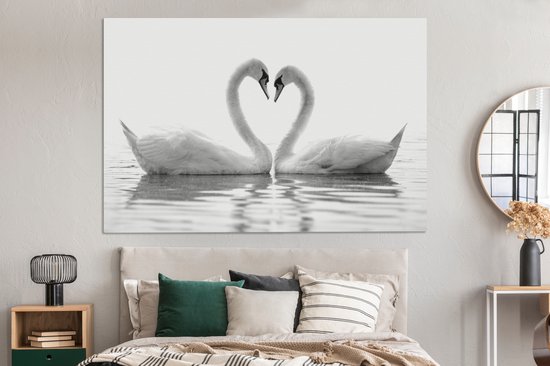 Canvas schilderij 150x100 cm - Wanddecoratie Twee zwanen die samen een hart vormen - zwart wit - Muurdecoratie woonkamer - Slaapkamer decoratie - Kamer accessoires - Schilderijen