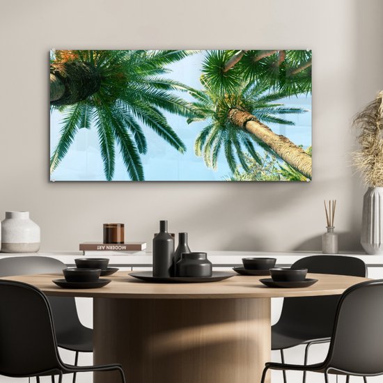 MuchoWow® Glasschilderij 80x40 cm - Schilderij acrylglas - Palmbladeren - Lucht - Zomer - Tropisch - Foto op glas - Schilderijen