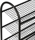 Detailopname van een zwart, metalen schoenenrek met een gebogen bovenrand en een roosterstructuur.