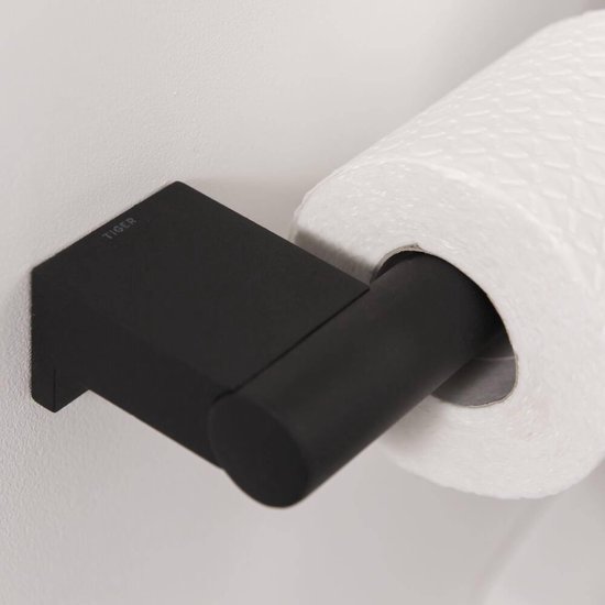 Porte-rouleau toilette noir avec papier toilette, logo Tiger sur la plaque de montage.