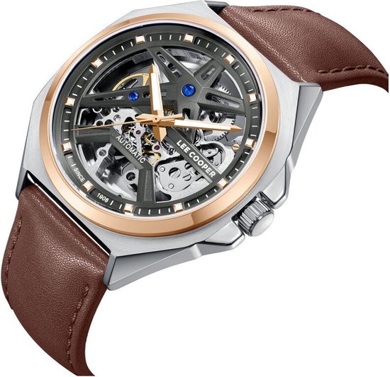 Herenautomaat horloge met zilverkleurige kast, rosé gouden ring en bruin leren band. De wijzerplaat is grijs en open.