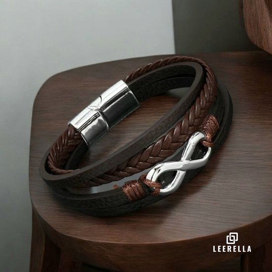 Bruine leren armband met gevlochten detail, infinity symbool en zilverkleurige sluiting.