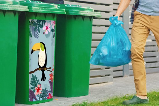 Groene kliko met tropische print: een toekan op een tak, omringd door bladeren en roze, rode en paarse bloemen.