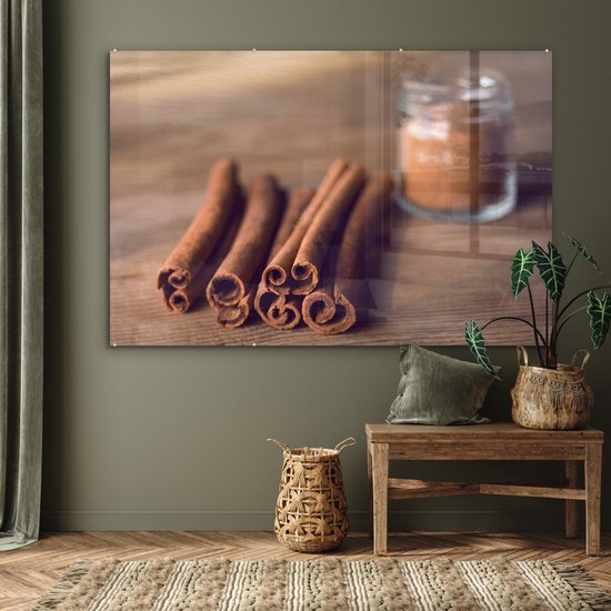 MuchoWow® Peinture sur verre 150x100 cm - Peinture sur verre acrylique - Bâtons de cannelle aromatiques sur une table en bois - Photo sur verre - Peintures