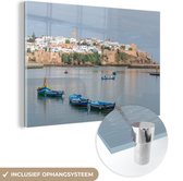 MuchoWow® Glasschilderij 180x120 cm - Schilderij acrylglas - Rabat met vissersboten op de rivier in Marokko - Foto op glas - Schilderijen