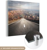 MuchoWow® Glasschilderij 90x90 cm - Schilderij acrylglas - Een brug in China met uitzicht op de stad - Foto op glas - Schilderijen