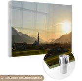MuchoWow® Glasschilderij 30x20 cm - Schilderij acrylglas - Oostenrijk - Zon - Toren - Foto op glas - Schilderijen
