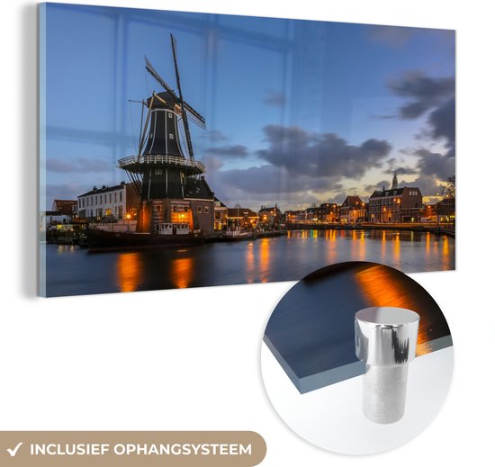 MuchoWow® Glasschilderij 80x40 cm - Schilderij acrylglas - Molen - Haarlem - Licht - Foto op glas - Schilderijen