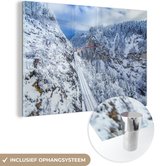 MuchoWow® Glasschilderij 120x80 cm - Schilderij acrylglas - Trein door het winterlandschap van Zwitserland - Foto op glas - Schilderijen