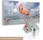 MuchoWow® Glasschilderij 120x60 cm - Schilderij acrylglas - Een flamingo staat op één poot in het water - Foto op glas - Schilderijen