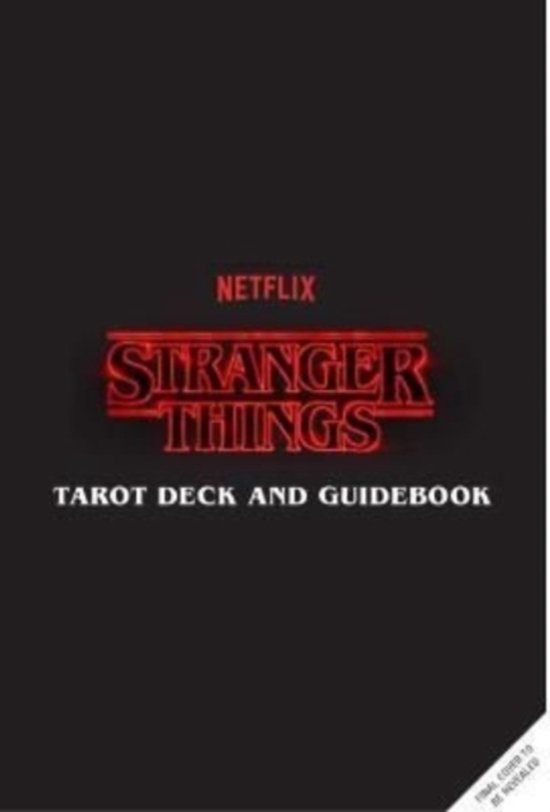 Boek met de titel "Stranger Things Tarot Deck and Guidebook" in rode neonletters op een zwarte achtergrond.