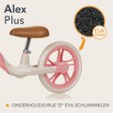 Close-up van een roze loopfiets wiel met witte rand en roze velg, detail van EVA schuim.