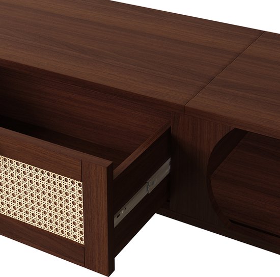 Detail van open lade van donkerhouten tv-meubel met rieten voorkant.