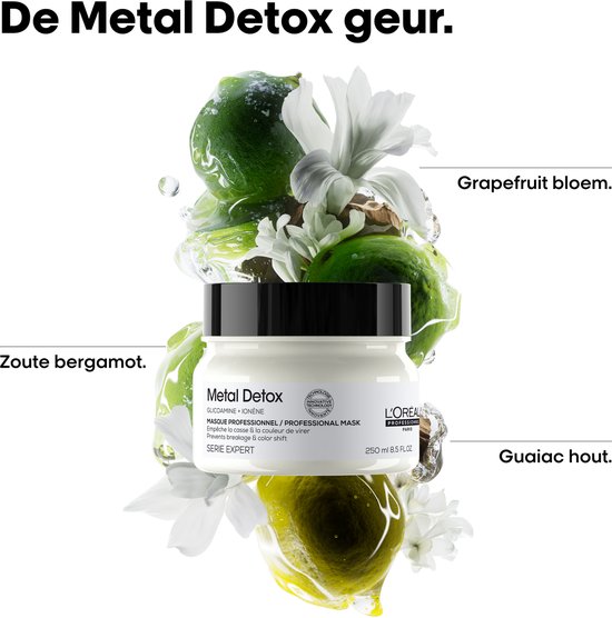 L'Oréal Metal Detox haarmasker omringd door grapefruit, bloemen en guaiac hout.